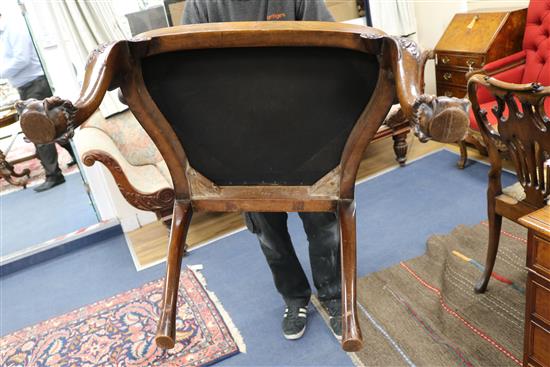 A pair of George I style walnut elbow chairs